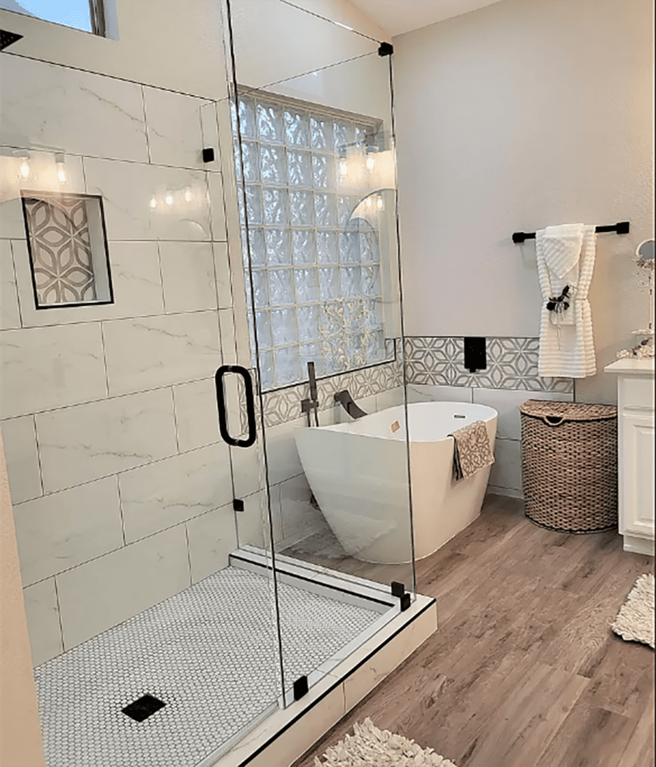 A bathroom with a tub and shower in it